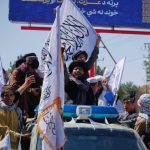 Afghanistan. Five years after the Taliban came to power, their supporters celebrate in the streets