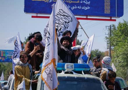 Afghanistan. Five years after the Taliban came to power, their supporters celebrate in the streets