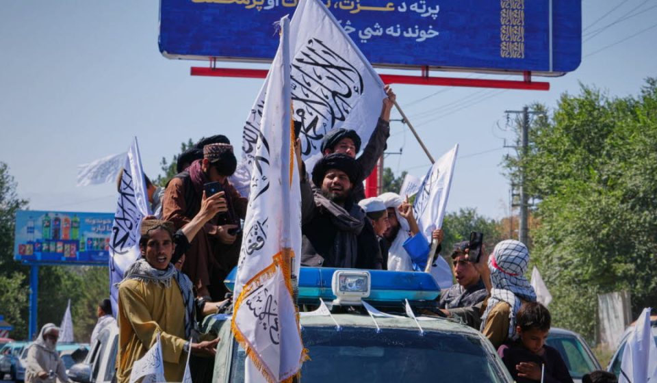 Afghanistan. Five years after the Taliban came to power, their supporters celebrate in the streets