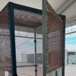Migrants were locked in mesh mini-cells in Florida, an “unprecedented” practice in the United States