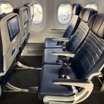 United Airlines passengers compete to move to empty economy seats