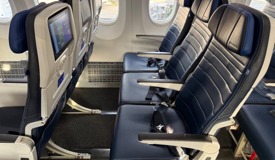 United Airlines passengers compete to move to empty economy seats
