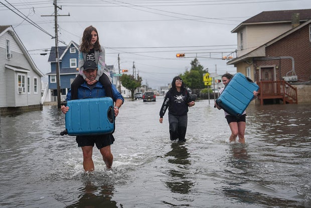 Nor'easter brings heavy flooding and major power outages to the East Coast