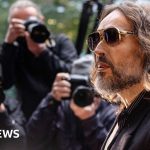 Russell Brand was a 'sexual predator,' prosecutors say as rape trial begins - BBC News Africa