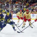 Michigan sets the tone by toppling number one Denver