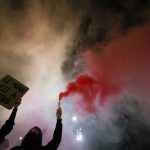Soldiers guard central Milan as thousands march in cities across Europe