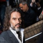 Russell Brand arrives at a London court for his rape and sexual assault trial