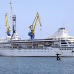 They bought cabins to live on a luxury cruise ship. High fuel costs pushed them to launch in Cambodia.