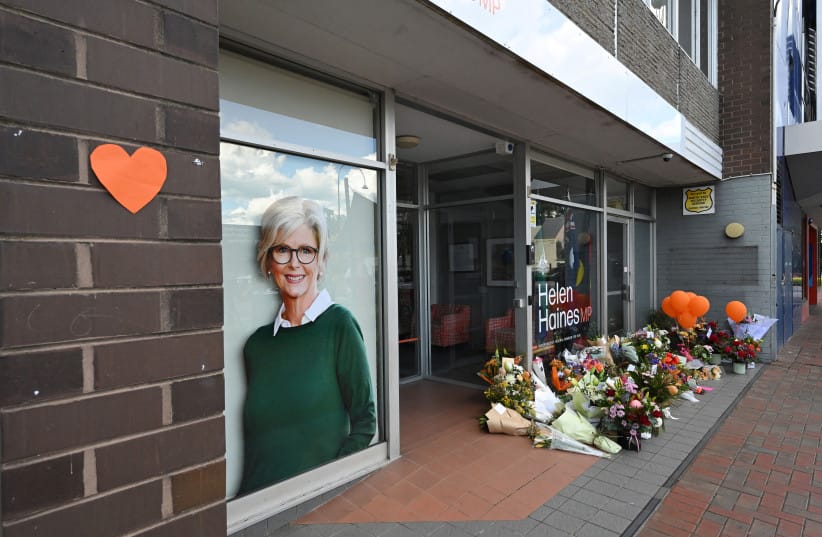Australian lawmaker attacked with car has legs amputated, husband says