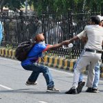 Indian police crack down on protest against 'cockroaches' in Delhi