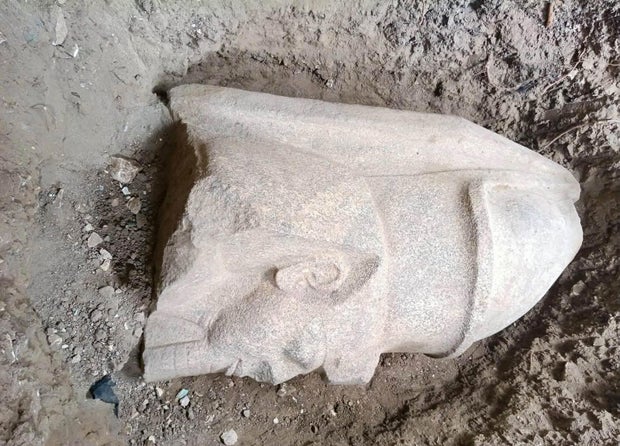 An Egyptian farmer discovered 'an unusual stone'. This led archaeologists to discover pieces of statues of an ancient king.