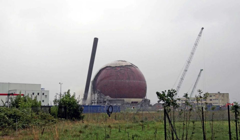 A 262-foot smokestack at a German nuclear power plant tipped onto its side seconds after the charges were triggered, and the 157-foot steel sphere that contained the reactor then descended, cleared to be cut up for scrapping, so the site could cease to be a nuclear power plant after 21 years of dismantling.