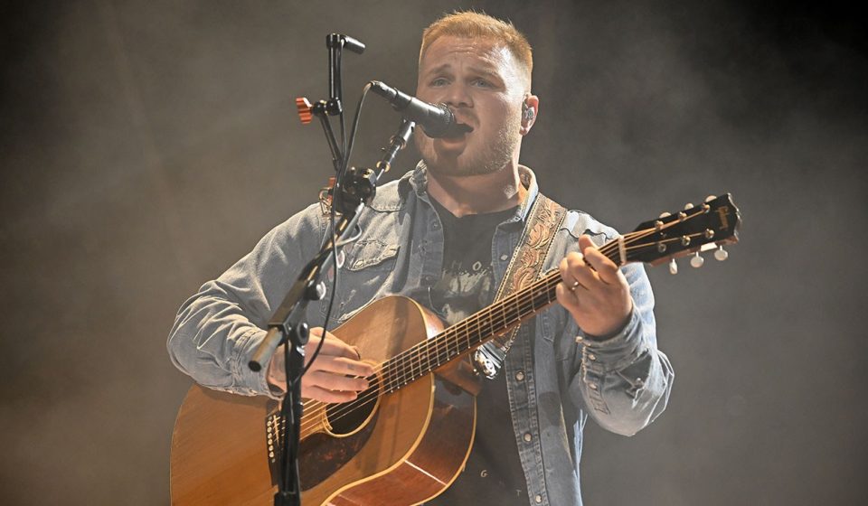 Zach Bryan wears a “Free Palestine” jersey during a concert at Gillette Stadium