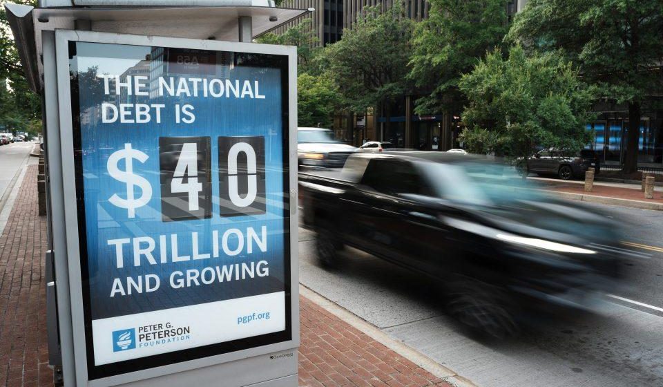 It is "probably implausible" that a strong economy could stabilize US debt when 5-6% growth is needed.