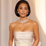 Kim Kardashian wows in plunging illusion dress with sheer fringed skirt