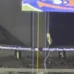 A soldier rappels from the ceiling before the UTSA football game at the Alamodome