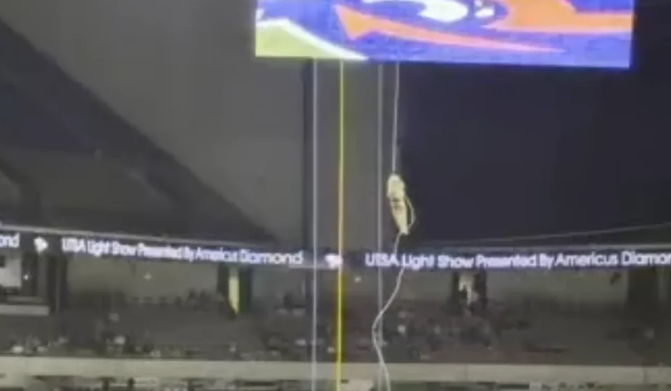 A soldier rappels from the ceiling before the UTSA football game at the Alamodome