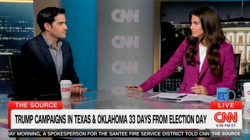 Kaitlan Collins shows off mug with Trump Dig