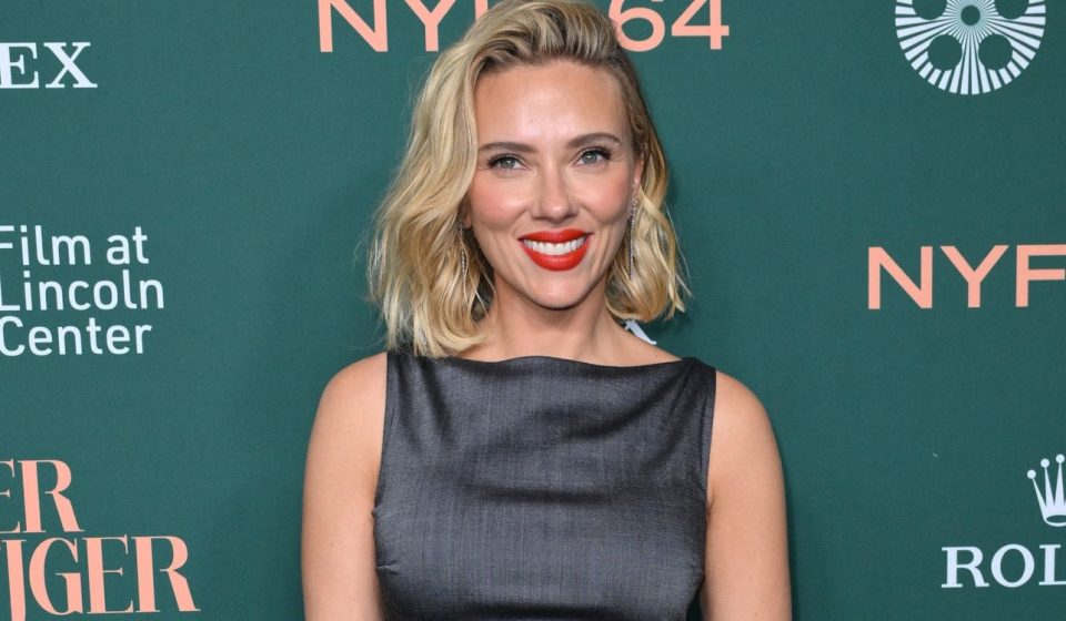 Scarlett Johansson wows in custom red Prada dress and gold heels in London