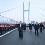 North Korea's Kim Jong Un touts ties, opens bridge with China on first trip in a year