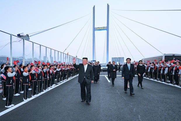 North Korea's Kim Jong Un touts ties, opens bridge with China on first trip in a year
