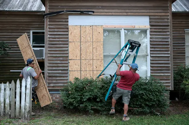 Hurricane Isaias downgrades to category three as evacuation orders are issued along US Gulf Coast - live updates