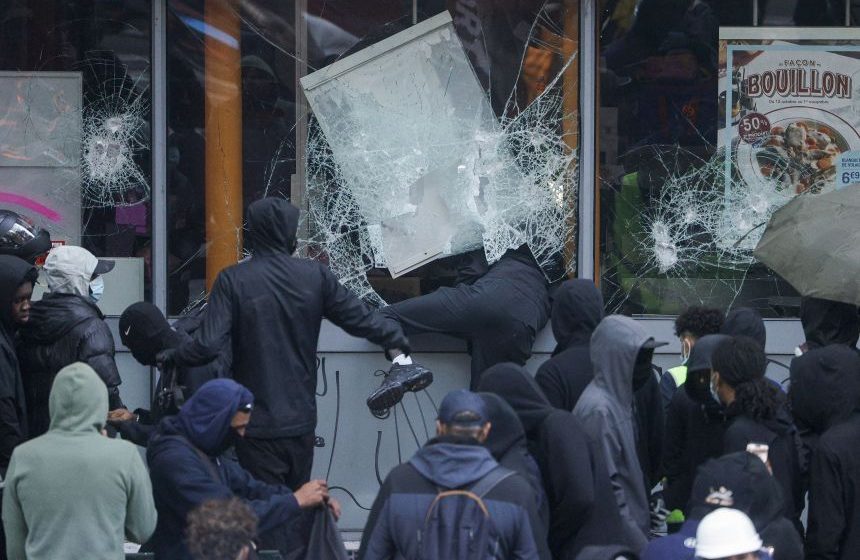 Macron denounces 'stupid comments' from world leaders after Trump blames migrants for France's unrest