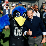 Pete Hegseth handles the Air Force-Navy coin toss after showing off his basketball skills at the Academy
