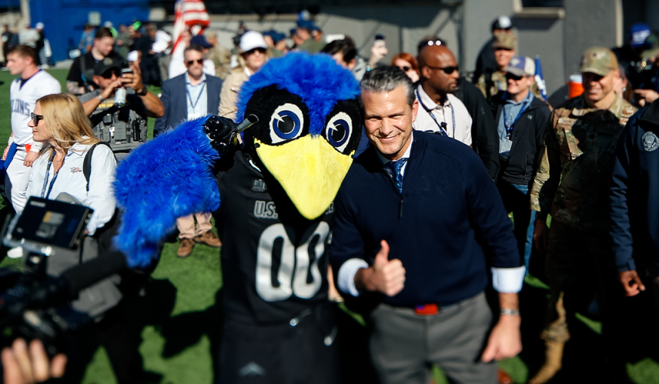 Pete Hegseth handles the Air Force-Navy coin toss after showing off his basketball skills at the Academy