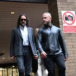 Russell Brand's indecent assault charge reduced by judge: trial continues