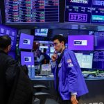 Stocks fall as dollar heads for weekly loss