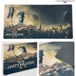 Claim your commemorative Space Marine 2 desk pad at your local Warhammer store