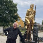 A golden, naked statue of Trump installed in the European Parliament