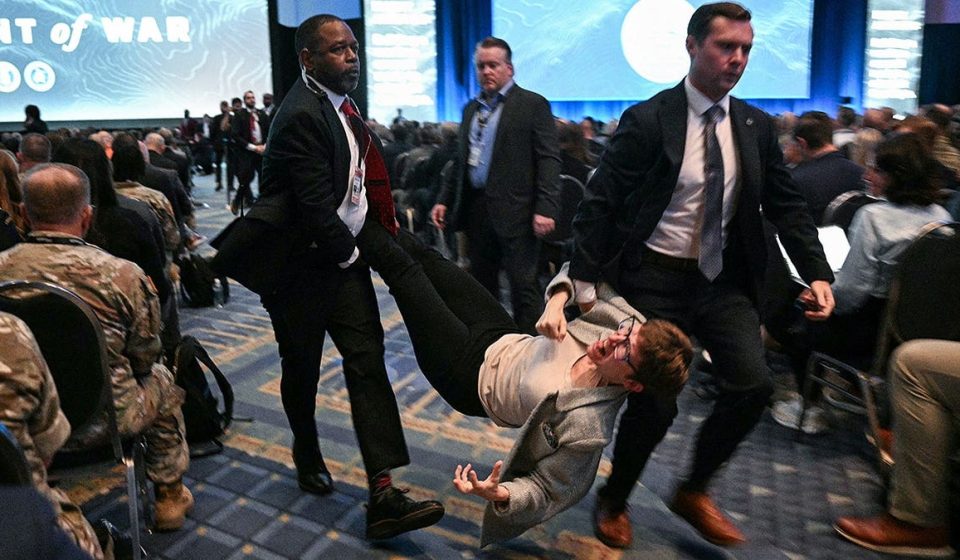 Pete Hegseth called war criminal by protesters at Army drone panel