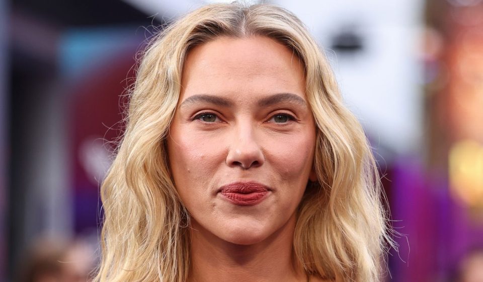 Scarlett Johansson shows off back tattoos in sizzling strapless dress